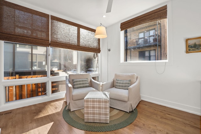 living area with visible vents, wood finished floors, recessed lighting, baseboards, and ceiling fan