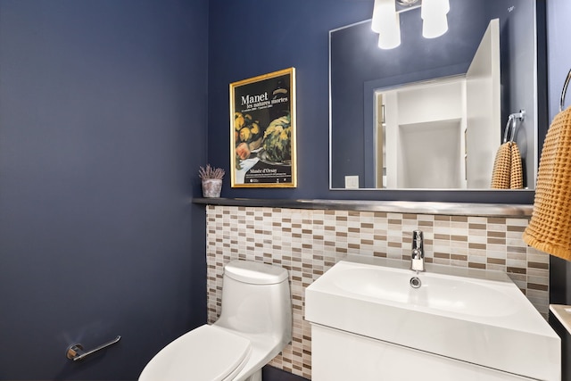 bathroom with toilet and vanity