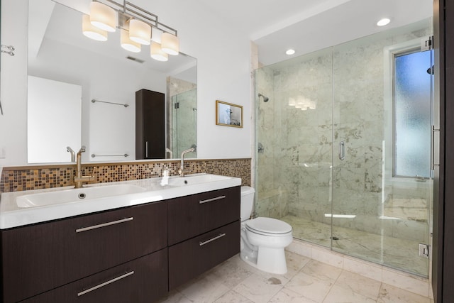 full bath with visible vents, marble finish floor, a shower stall, and a sink