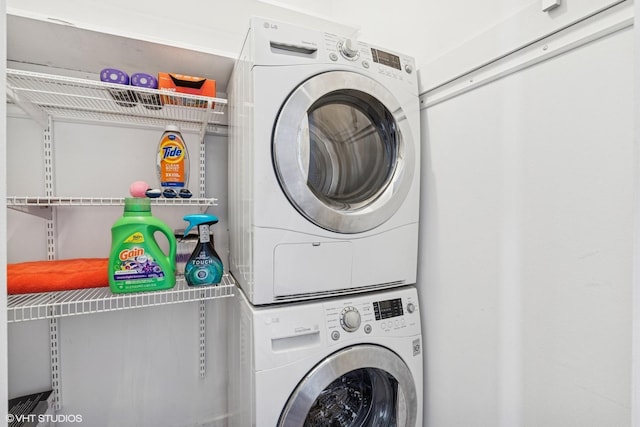 laundry area featuring laundry area and stacked washer / drying machine