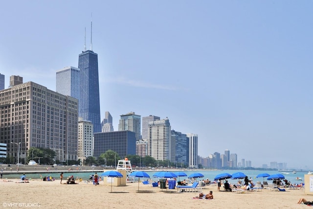 exterior space featuring a view of city and a view of the beach