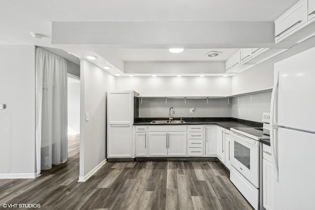 kitchen featuring white appliances, open shelves, a sink, dark wood-type flooring, and dark countertops