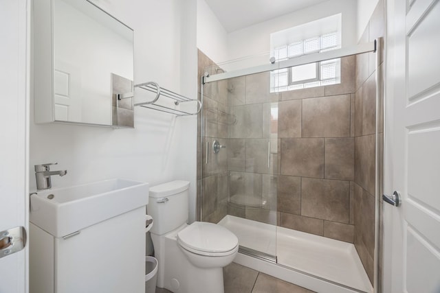 full bathroom with a shower stall, toilet, and tile patterned floors