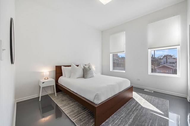 bedroom featuring visible vents and baseboards