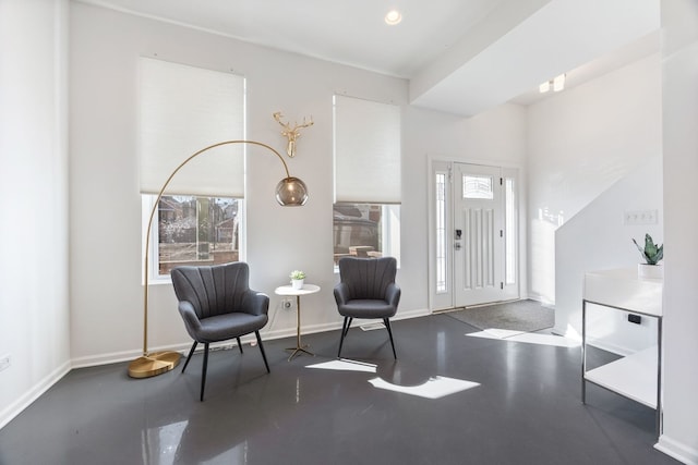 foyer featuring recessed lighting and baseboards