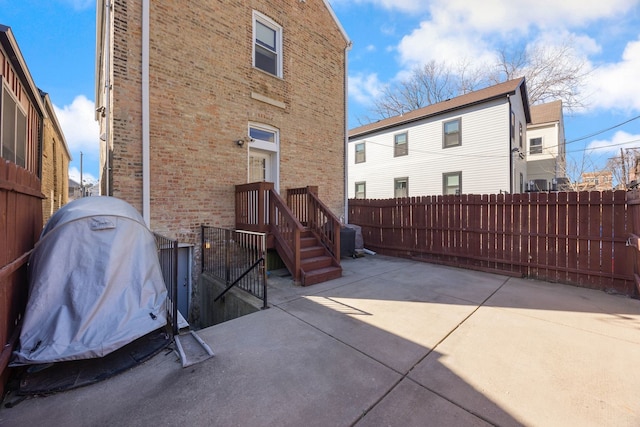 view of patio / terrace featuring fence