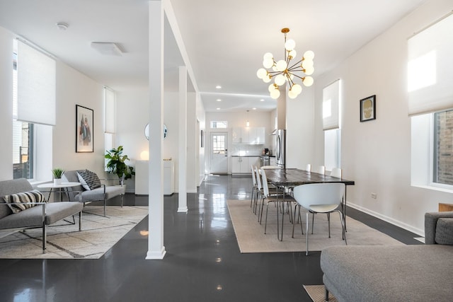 dining space featuring an inviting chandelier, recessed lighting, and baseboards