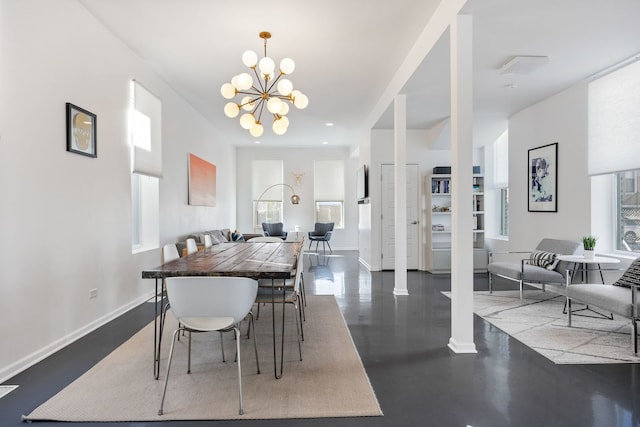 dining room featuring recessed lighting, baseboards, and an inviting chandelier