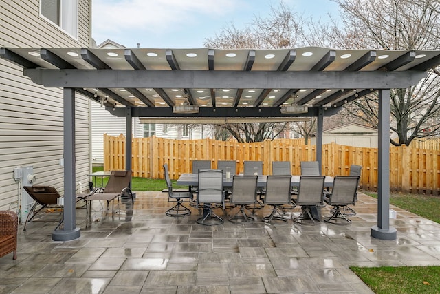 view of patio featuring fence