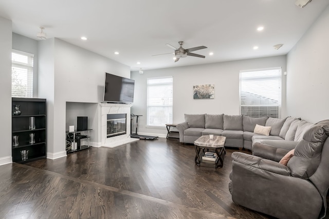 living room with recessed lighting, a healthy amount of sunlight, and wood finished floors