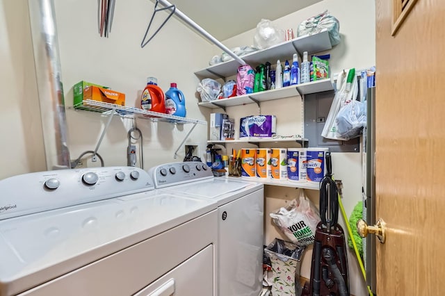 washroom featuring washing machine and clothes dryer and laundry area