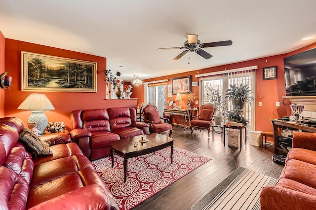 living area featuring a ceiling fan and wood-type flooring