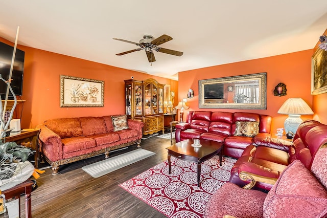 living room with a ceiling fan and wood finished floors