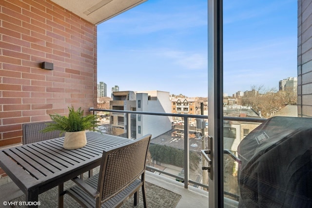 balcony featuring area for grilling