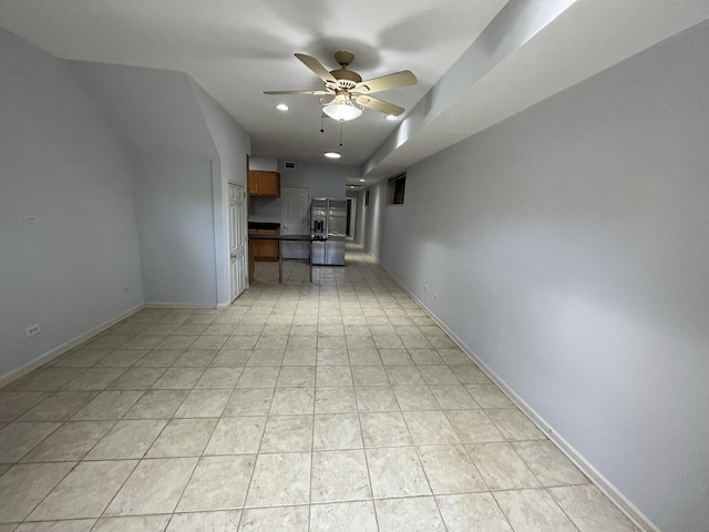 unfurnished living room featuring light tile patterned flooring, recessed lighting, baseboards, and ceiling fan