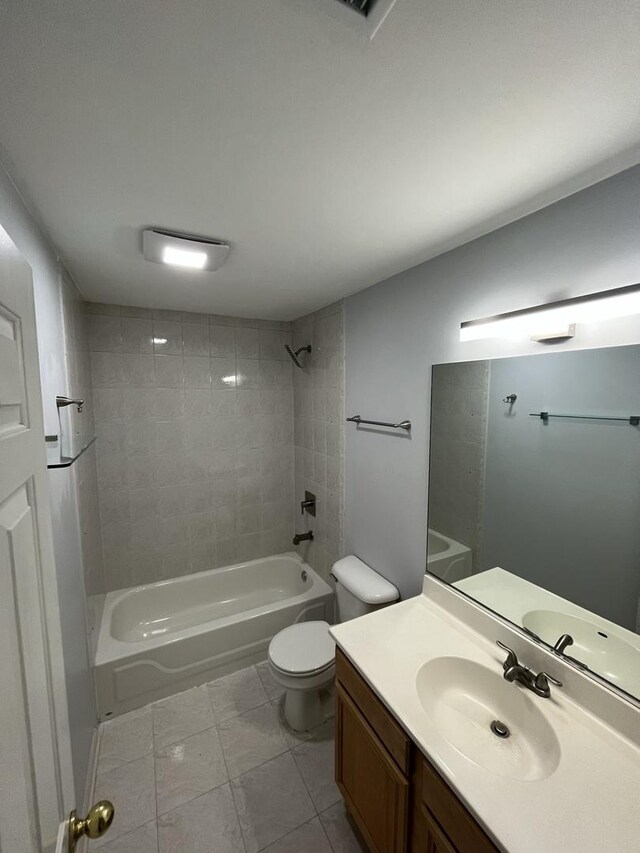 bathroom with bathtub / shower combination, toilet, and vanity