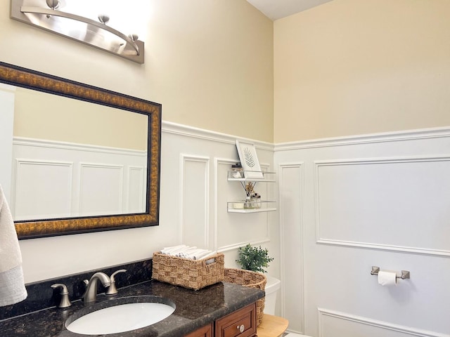 bathroom with toilet and vanity