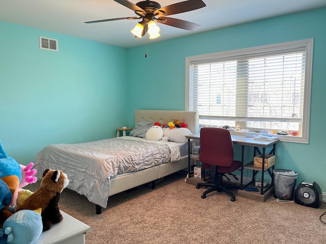bedroom with visible vents, ceiling fan, and carpet flooring