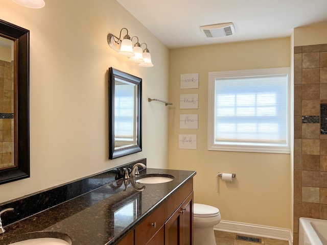 bathroom with a sink, visible vents, and a wealth of natural light