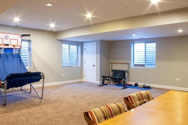 interior space featuring recessed lighting, a healthy amount of sunlight, and carpet floors