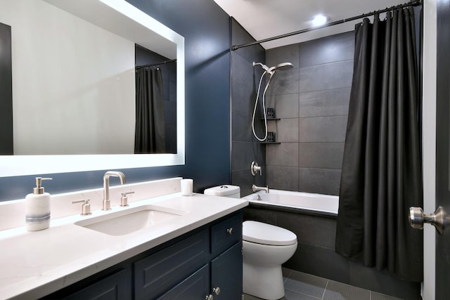 bathroom featuring toilet, shower / bath combo, vanity, and tile patterned flooring