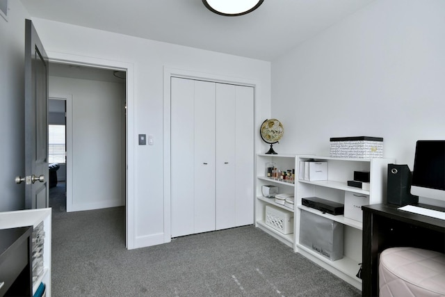 carpeted home office featuring visible vents and baseboards