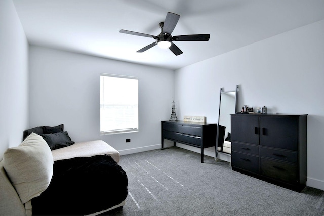 living area with baseboards, carpet, and ceiling fan