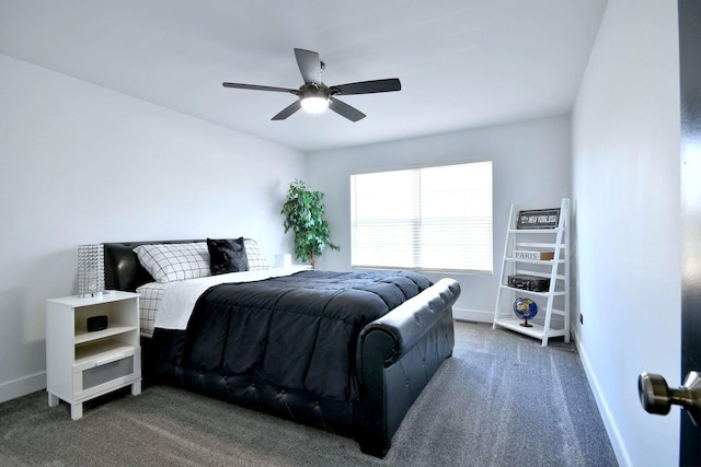 carpeted bedroom with baseboards and a ceiling fan