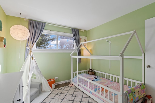 bedroom featuring baseboards