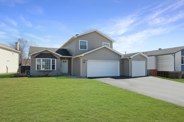 view of front of home with a front yard, fence, driveway, a garage, and central air condition unit