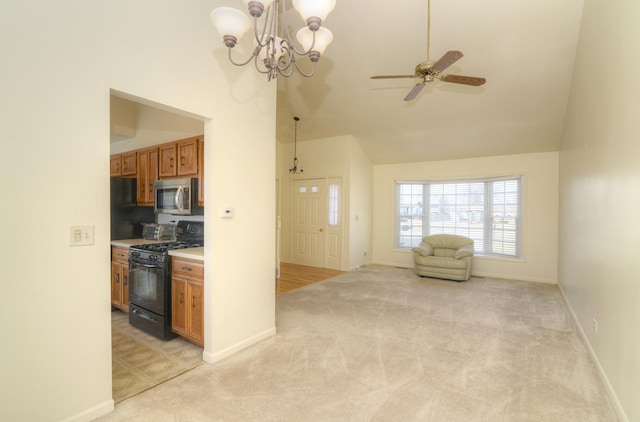 kitchen featuring stainless steel microwave, black gas stove, light colored carpet, and brown cabinets