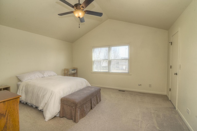 bedroom with light colored carpet, baseboards, lofted ceiling, and a ceiling fan