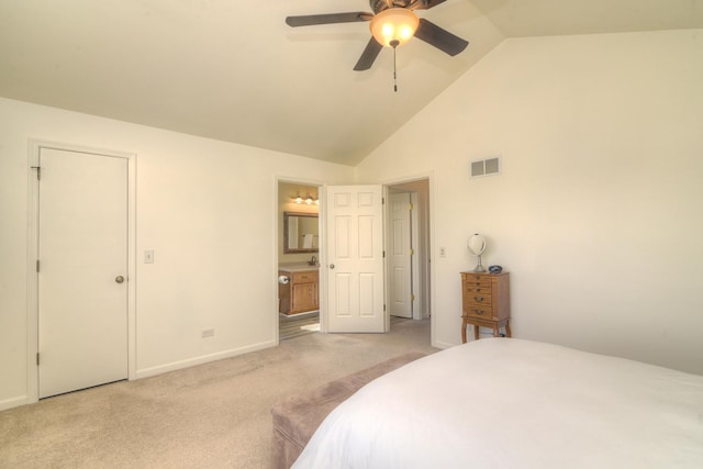 carpeted bedroom with visible vents, baseboards, high vaulted ceiling, and ensuite bath