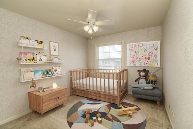 bedroom featuring baseboards, light carpet, and wallpapered walls