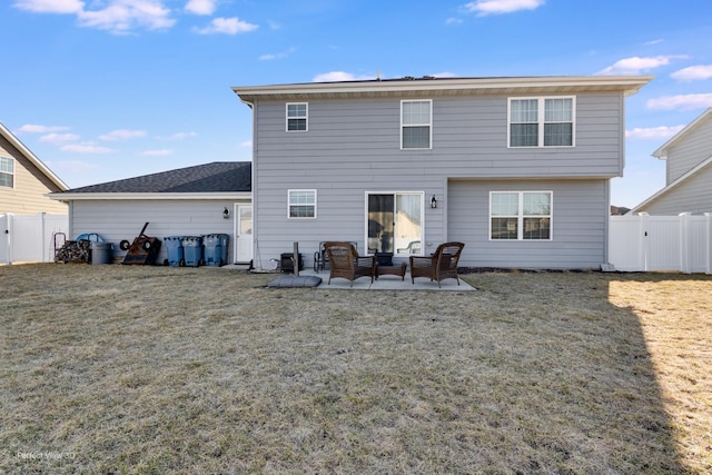 rear view of house featuring a yard, a patio, a fenced backyard, and a gate