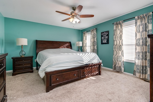 bedroom with baseboards, carpet floors, and ceiling fan