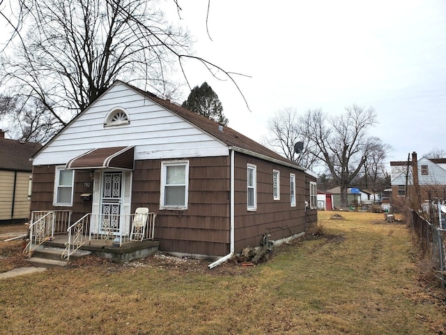 bungalow with a front lawn