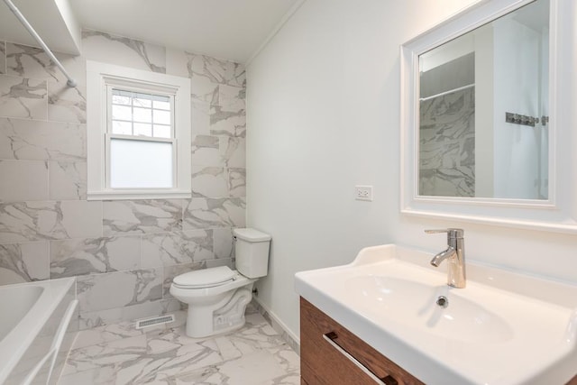 bathroom featuring vanity, visible vents, a tub, toilet, and marble finish floor