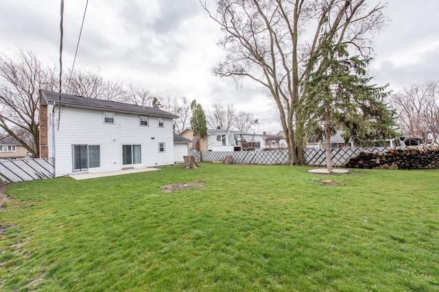 view of yard featuring a patio and fence