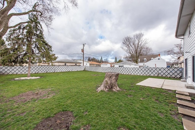 view of yard featuring a patio and fence