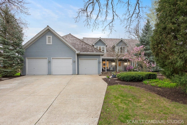 2017 Mustang Dr, Naperville, IL 60565 - view of front of home featuring concrete driveway, an attached garage, and covered porch