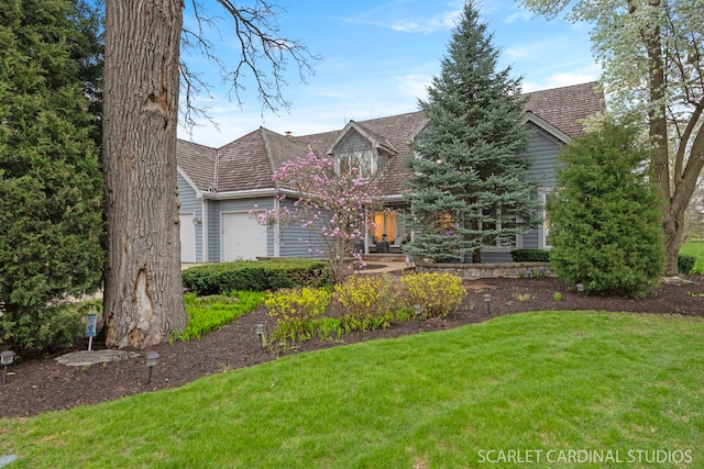 2017 Mustang Dr, Naperville, IL 60565 - cape cod house featuring a garage and a front lawn