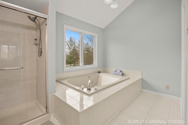 full bath featuring tile patterned floors, baseboards, a shower stall, vaulted ceiling, and a garden tub