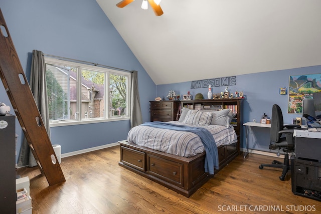 bedroom with baseboards, ceiling fan, vaulted ceiling, and wood finished floors