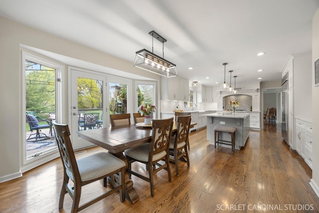 dining space with recessed lighting and dark wood-style flooring