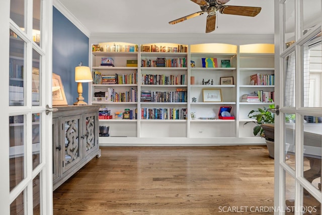 living area featuring ornamental molding, french doors, and wood finished floors