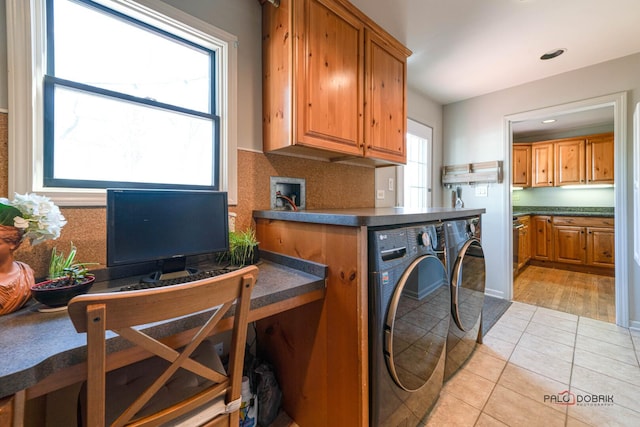 laundry area featuring washing machine and clothes dryer, light tile patterned floors, cabinet space, and recessed lighting