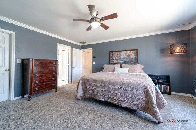 carpeted bedroom featuring ceiling fan, baseboards, visible vents, and ornamental molding