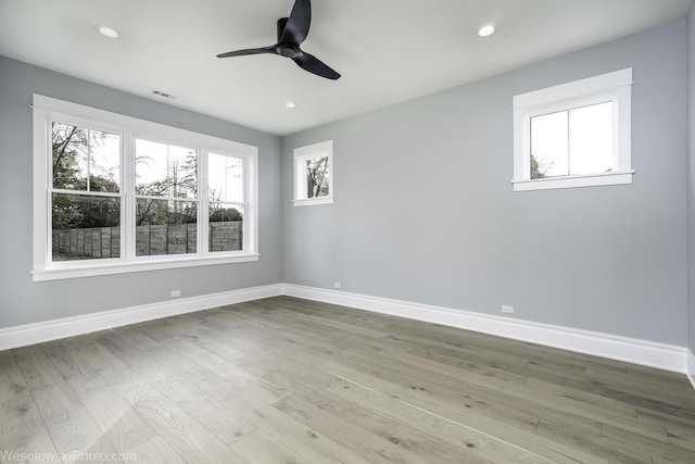 unfurnished room featuring recessed lighting, baseboards, wood finished floors, and a ceiling fan