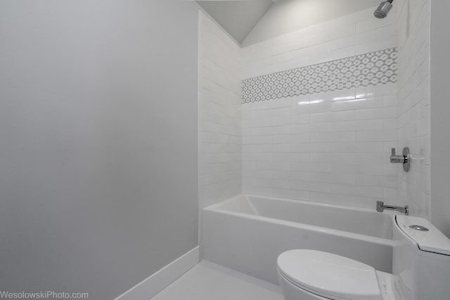 full bath with vaulted ceiling, toilet, baseboards, and shower / bathtub combination